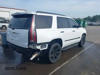 2020 Cadillac Escalade Luxury z VIN 1GYS3BKJ3LR144735, wystawiony jako IAAI lot #42161511 z przebiegiem 77 990 mil mil oraz . Historia ofert i sprzedaży dostępna na DreamBid. Obrazek 4.