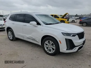 2024 Cadillac XT6 FWD Luxury with VIN 1GYKPAR47RZ720446, listed as a Copart auction lot 51762695 with 10,728 mi miles and Salvage Title. Bid and sale history available at carsss.com. Image 4.