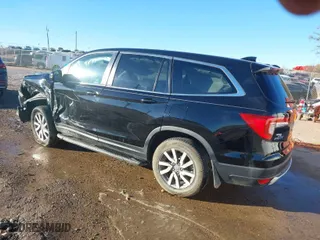 2021 Honda Pilot EX-L with VIN 5FNYF5H54MB038028, listed as a IAAI auction lot 41398565 with 63,779 mi miles. Bid and sale history available at carsss.com. Image 3.