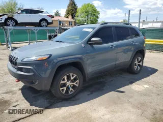 2014 Jeep Cherokee Trailhawk z VIN 1C4PJMBBXEW134939, wystawiony jako Copart lot #56579125 z przebiegiem 155 693 mil mil oraz Czysty tytuł • Clean title. Historia ofert i sprzedaży dostępna na DreamBid. Obrazek 1.