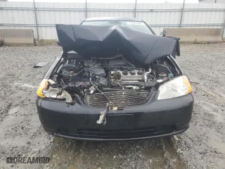 2002 Honda Civic LX with VIN 1HGEM21572L063504, listed as a Copart auction lot 71024364 with 0 mi miles and Salvage Title. Bid and sale history available at carsss.com. Image 5.