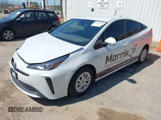 2021 Toyota Prius L Eco with VIN JTDKAMFU8M3133925, listed as a IAAI auction lot 41966660 with 115,193 mi miles. Bid and sale history available at carsss.com. Image 2.