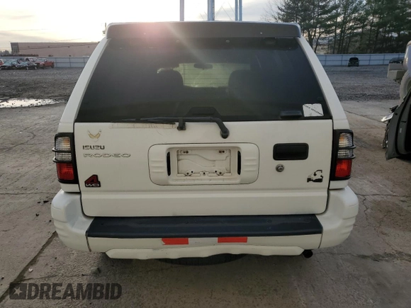 2003 Isuzu Rodeo with VIN 4S2DM58W034303129, listed as a Copart auction lot 83757734 with 114,274 mi miles and Salvage Title. Bid and sale history available at DreamBid. Image 6.