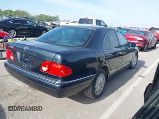 1997 Mercedes-Benz E-Class with VIN WDBJF55F7VJ027080, listed as a IAAI auction lot 42120838 with 150,197 mi miles. Bid and sale history available at carsss.com. Image 4.