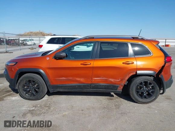 2016 Jeep Cherokee Trailhawk with VIN 1C4PJMBBXGW251682, listed as a IAAI auction lot 41973696 with 100,411 mi miles. Bid and sale history available at carsss.com. Image 15.