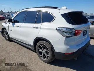 2016 BMW X1 xDrive28i z VIN WBXHT3C32G5E51855, wystawiony jako IAAI lot #41634237 z przebiegiem 69 101 mil mil oraz . Historia ofert i sprzedaży dostępna na DreamBid. Obrazek 3.