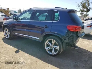 2015 Volkswagen Tiguan SE with VIN WVGAV7AX2FW094359, listed as a Copart auction lot 60101885 with 106,305 mi miles and Salvage title. Bid and sale history available at DreamBid. Image 2.