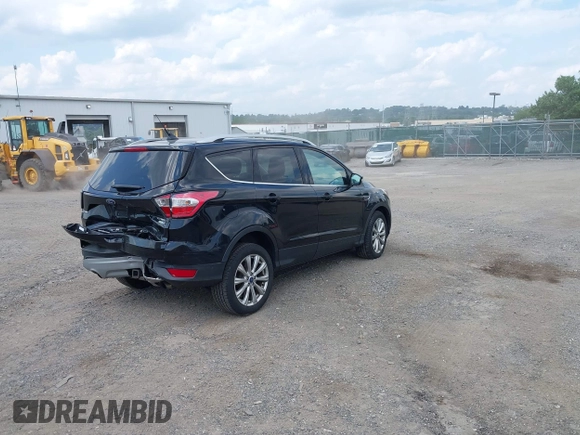 2018 Ford Escape Titanium z VIN 1FMCU9J9XJUB66275, wystawiony jako IAAI lot #42757952 z przebiegiem 97 629 mil mil oraz . Historia ofert i sprzedaży dostępna na DreamBid. Obrazek 4.