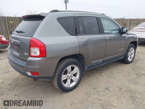 2011 Jeep Compass with VIN 1J4NT1FA2BD241485, listed as a IAAI auction lot 41496076 with 134,825 mi miles. Bid and sale history available at carsss.com. Image 4.