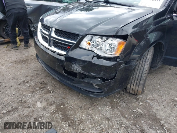 2019 Dodge Grand Caravan SXT with VIN 2C4RDGCG9KR804867, listed as a IAAI auction lot 42032311 with 157,351 mi miles and . Bid and sale history available at DreamBid. Image 6.