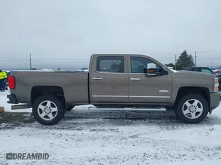 2015 Chevrolet Silverado 2500HD Built After Aug 14 High Country with VIN 1GC1KXE89FF543780, listed as a IAAI auction lot 41557608 with 164,171 mi miles. Bid and sale history available at carsss.com. Image 14.