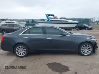 2015 Cadillac CTS AWD z VIN 1G6AW5SX6F0116891, wystawiony jako IAAI lot #42077259 z przebiegiem 119 426 mil mil oraz . Historia ofert i sprzedaży dostępna na DreamBid. Obrazek 13.