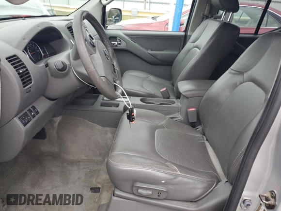 2014 Nissan Frontier SL z VIN 1N6AD0FV2EN720242, wystawiony jako Copart lot #86976214 z przebiegiem 118 581 mil mil oraz Szkoda całkowita • Salvage title. Historia ofert i sprzedaży dostępna na DreamBid. Obrazek 7.