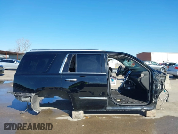 2015 Cadillac Escalade Premium z VIN 1GYS3NKJ5FR655370, wystawiony jako IAAI lot #41764570 z przebiegiem Nie podano mil oraz . Historia ofert i sprzedaży dostępna na DreamBid. Obrazek 14.