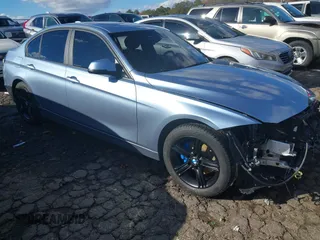 2015 BMW 3 Series 328i xDrive with VIN WBA3B3C53FJ984051, listed as a IAAI auction lot 40878423 with 35,426 mi miles. Bid and sale history available at carsss.com. Image 1.