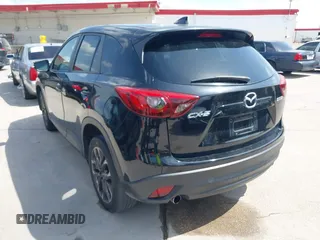 2016 Mazda CX-5 Grand Touring z VIN JM3KE2DY2G0765444, wystawiony jako IAAI lot #42527577 z przebiegiem 162 871 mil mil oraz . Historia ofert i sprzedaży dostępna na DreamBid. Obrazek 3.
