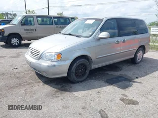 2003 Kia Sedona LX with VIN KNDUP131236417368, listed as a IAAI auction lot 41863624 with 142,896 mi miles. Bid and sale history available at carsss.com. Image 2.