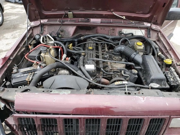 2000 Jeep Cherokee z VIN 1J4FF48S0YL254270, wystawiony jako Copart lot #52589415 z przebiegiem 166 860 mil mil oraz Szkoda całkowita • Salvage title. Historia ofert i sprzedaży dostępna na DreamBid. Obrazek 13.