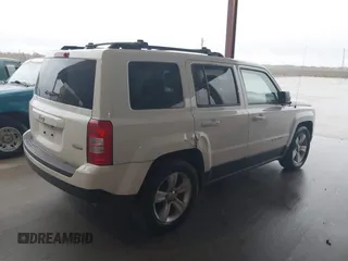 2014 Jeep Patriot Latitude with VIN 1C4NJPFA3ED618523, listed as a IAAI auction lot 41108657 with 124,035 mi miles and . Bid and sale history available at carsss.com. Image 4.