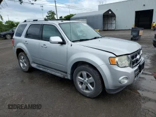 2010 Ford Escape Limited with VIN 1FMCU9EG3AKC97990, listed as a Copart auction lot 61552055 with 278,447 mi miles and Salvage title. Bid and sale history available at DreamBid. Image 4.