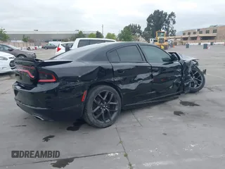2019 Dodge Charger SXT with VIN 2C3CDXBG6KH681711, listed as a IAAI auction lot 42130733 with 58,050 mi miles. Bid and sale history available at carsss.com. Image 4.