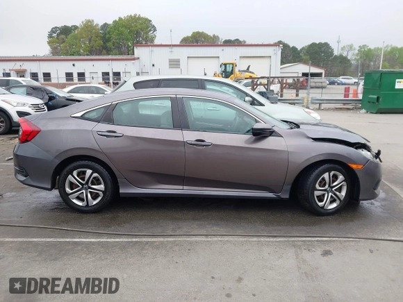 2017 Honda Civic LX z VIN 19XFC2F53HE023730, wystawiony jako IAAI lot #41885003 z przebiegiem 129 595 mil mil oraz . Historia ofert i sprzedaży dostępna na DreamBid. Obrazek 13.