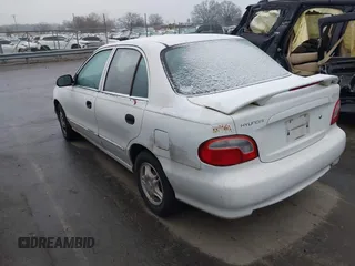 1999 Hyundai Accent z VIN KMHVF24N1XU583604, wystawiony jako IAAI lot #41613240 z przebiegiem 163 938 mil mil oraz . Historia ofert i sprzedaży dostępna na DreamBid. Obrazek 3.