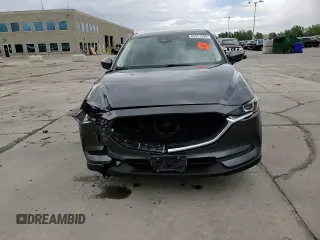 2018 Mazda CX-5 Touring z VIN JM3KFBCM4J0349687, wystawiony jako Copart lot #55857945 z przebiegiem Nie podano mil oraz Szkoda całkowita • Salvage title. Historia ofert i sprzedaży dostępna na DreamBid. Obrazek 14.