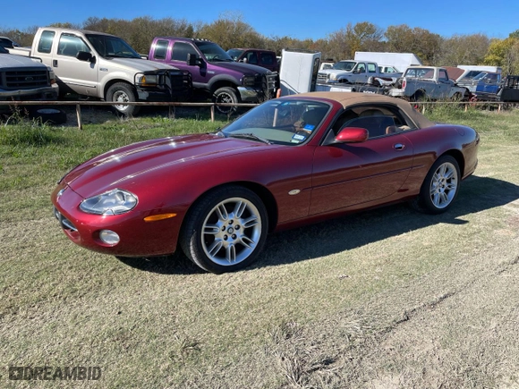 2001 Jaguar XK8 with VIN SAJDA42C91NA17787, listed as a Copart auction lot 82167354 with 98506 miles and Clean Title. Bid and sale history available at carsss.com. Image 2.