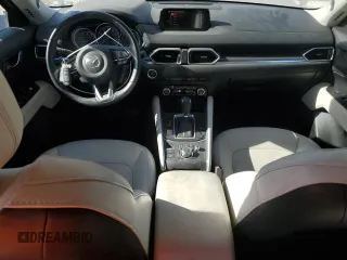 2018 Mazda CX-5 Grand Touring with VIN JM3KFADM4J1341740, listed as a Copart auction lot 46805955 with 99,114 mi miles and Salvage Title. Bid and sale history available at DreamBid. Image 8.