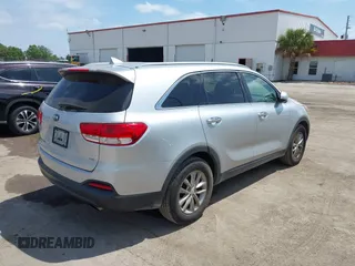 2016 Kia Sorento LX with VIN 5XYPG4A54GG009459, listed as a IAAI auction lot 42113972 with 158,950 mi miles. Bid and sale history available at carsss.com. Image 4.