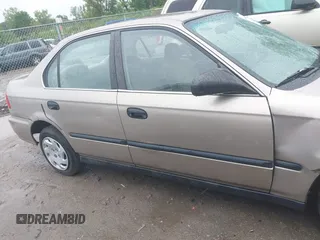 2000 Honda Civic LX z VIN 1HGEJ6678YL039165, wystawiony jako IAAI lot #42441308 z przebiegiem 174 584 mil mil oraz . Historia ofert i sprzedaży dostępna na DreamBid. Obrazek 13.