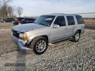 2000 GMC Denali z VIN 1GKEK63R1YR193039, wystawiony jako Copart lot #49256685 z przebiegiem 193 319 mil mil oraz Tytuł czysty. Historia ofert i sprzedaży dostępna na DreamBid. Obrazek 1.