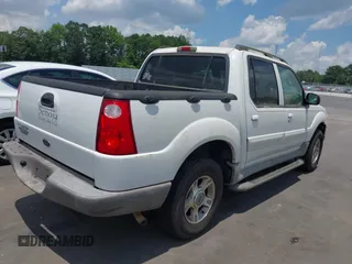 2003 Ford Explorer Sport Trac XLS z VIN 1FMZU67E63UB48999, wystawiony jako IAAI lot #42696231 z przebiegiem 86 900 mil mil oraz . Historia ofert i sprzedaży dostępna na DreamBid. Obrazek 4.