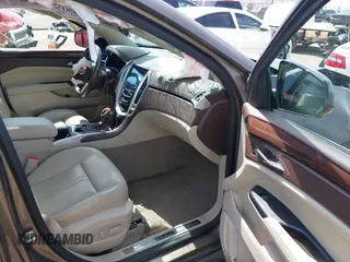 2016 Cadillac SRX Performance Collection z VIN 3GYFNCE39GS512286, wystawiony jako IAAI lot #42392467 z przebiegiem 95 708 mil mil oraz . Historia ofert i sprzedaży dostępna na DreamBid. Obrazek 5.