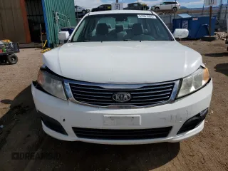 2010 Kia Optima LX z VIN KNAGG4A8XA5382979, wystawiony jako Copart lot #57067065 z przebiegiem 104 611 mil mil oraz Szkoda całkowita • Salvage title. Historia ofert i sprzedaży dostępna na DreamBid. Obrazek 5.