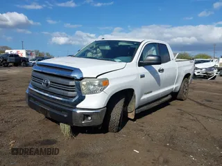 2014 Toyota Tundra 4WD Truck SR with VIN 5TFUY5F1XEX385475, listed as a IAAI auction lot 41563188 with 135,310 mi miles. Bid and sale history available at carsss.com. Image 6.