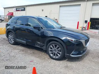 2022 Mazda CX-9 Grand Touring with VIN JM3TCBDYXN0627657, listed as a IAAI auction lot 42498856 with 61,044 mi miles and . Bid and sale history available at DreamBid. Image 1.