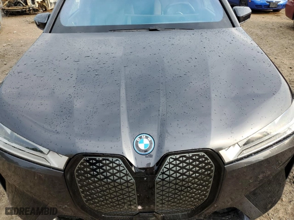 2022 BMW iX xDrive50 with VIN WB523CF05NCK47671, listed as a Copart auction lot 69265573 with 13,090 mi miles. Bid and sale history available at carsss.com. Image 12.