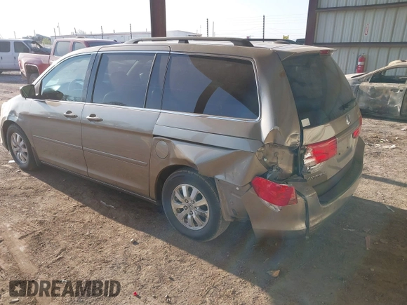 2010 Honda Odyssey EX-L with VIN 5FNRL3H79AB048049, listed as a IAAI auction lot 42055090 with 142,736 mi miles. Bid and sale history available at carsss.com. Image 3.