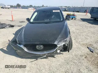 2018 Mazda CX-5 Grand Touring z VIN JM3KFBDM0J0399985, wystawiony jako Copart lot #54097665 z przebiegiem 45 344 mil mil oraz Szkoda całkowita • Salvage title. Historia ofert i sprzedaży dostępna na DreamBid. Obrazek 14.