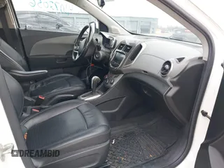 2014 Chevrolet Sonic LTZ with VIN 1G1JE5SH3E4133088, listed as a IAAI auction lot 41072056 with 143,855 mi miles. Bid and sale history available at carsss.com. Image 5.
