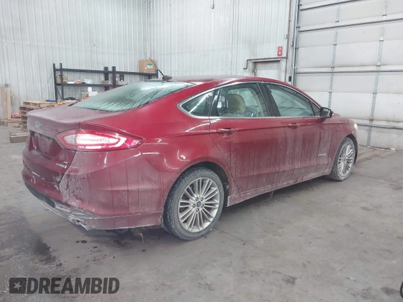 2014 Ford Fusion SE Hybrid with VIN 3FA6P0LU5ER136237, listed as a IAAI auction lot 41590088 with 174,009 mi miles. Bid and sale history available at carsss.com. Image 4.