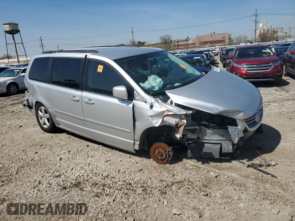 2011 Volkswagen Routan SE with VIN 2V4RW3DG0BR621820, listed as a Copart auction lot 87670825 with 180,222 mi miles and Salvage title. Bid and sale history available at DreamBid. Image 4.