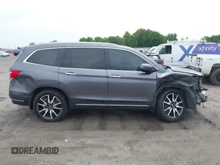 2019 Honda Pilot Touring 8-Passenger with VIN 5FNYF5H93KB028641, listed as a IAAI auction lot 42524078 with 56,744 mi miles and . Bid and sale history available at DreamBid. Image 14.