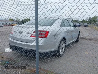 2013 Ford Taurus SEL with VIN 1FAHP2H87DG191746, listed as a IAAI auction lot 40445448 with 231,634 mi miles and . Bid and sale history available at DreamBid. Image 4.