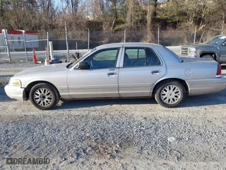 2005 Ford Crown Victoria LX with VIN 2FAFP74W85X121984, listed as a IAAI auction lot 41427678 with 113,437 mi miles. Bid and sale history available at carsss.com. Image 14.