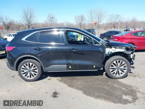 2020 Ford Escape Titanium z VIN 1FMCU9J98LUA44923, wystawiony jako IAAI lot #41779691 z przebiegiem 73 259 mil mil oraz . Historia ofert i sprzedaży dostępna na DreamBid. Obrazek 13.