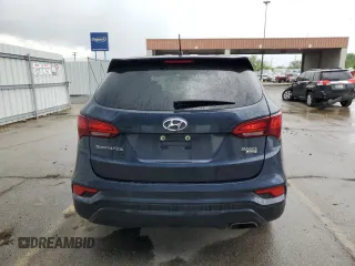 2018 Hyundai Santa Fe 2.4L z VIN 5NMZTDLB7JH077713, wystawiony jako Copart lot #56671245 z przebiegiem 90 442 mil mil oraz Szkoda całkowita • Salvage title. Historia ofert i sprzedaży dostępna na DreamBid. Obrazek 6.