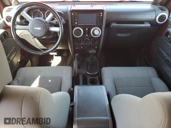 2008 Jeep Wrangler Unlimited Sahara with VIN 1J4GA59168L534967, listed as a Copart auction lot 54894635 with 180,581 mi miles and Salvage title. Bid and sale history available at DreamBid. Image 8.